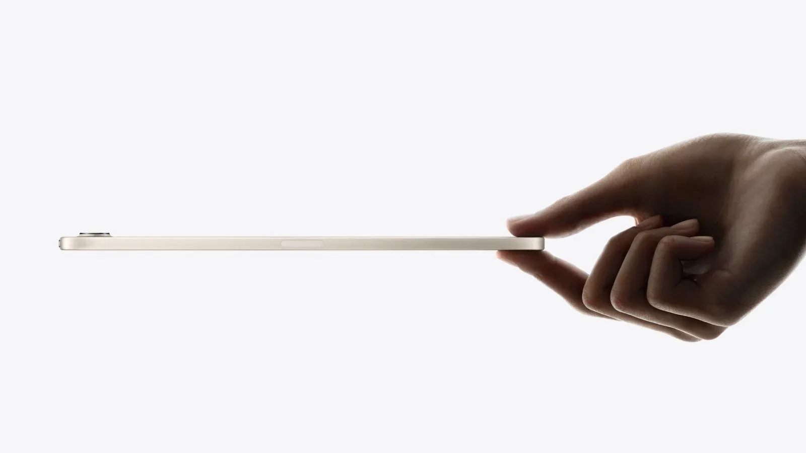 An iPad mini held in a hand without a pinched-fingers gesture