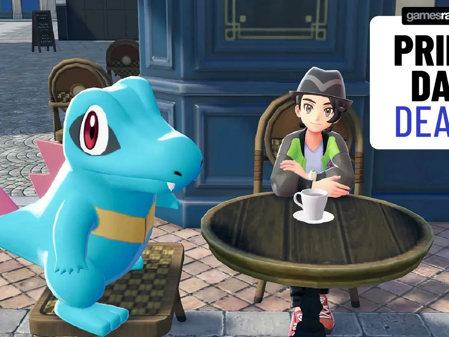 A Totodile and trainer look up from a table with a coffee cup, with a GamesRadar+ Prime Day deals badge in the top right-hand corner of the frame