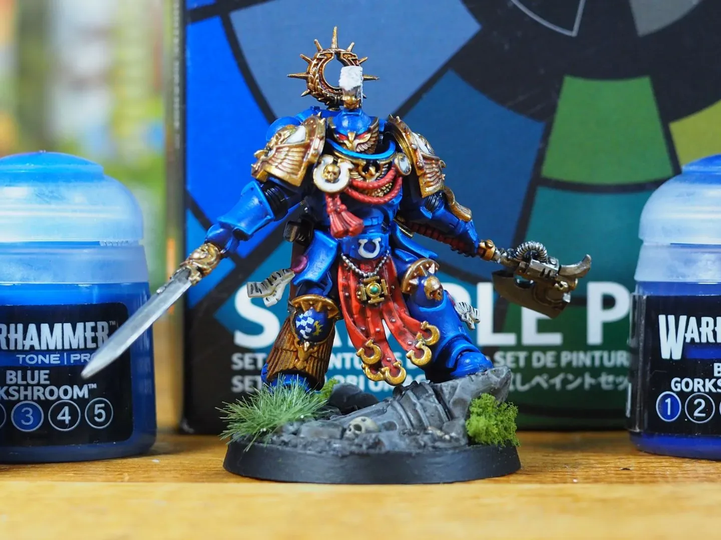 Kaius Konorious miniature painted using Warhammer Tone Pro, surrounded by paint pots