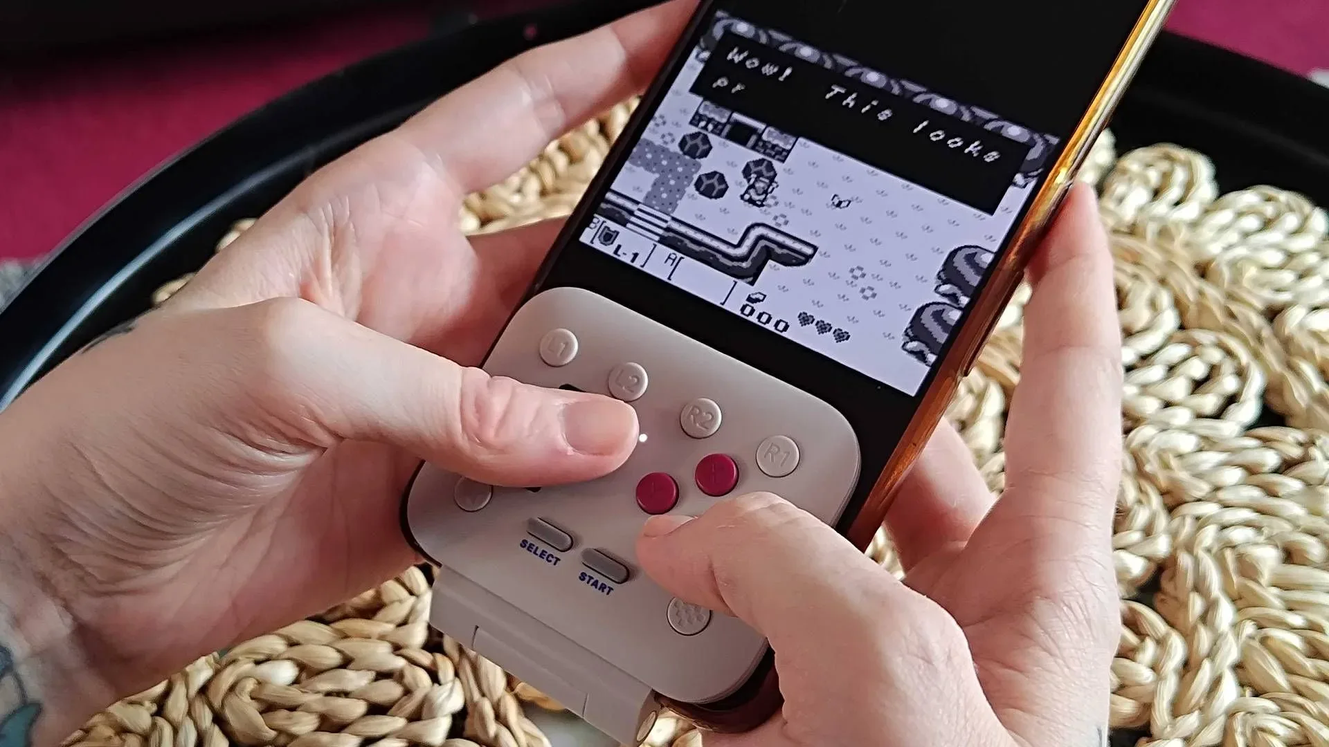 8Bitdo FlipPad folded against a compatible USB-C smartphone
