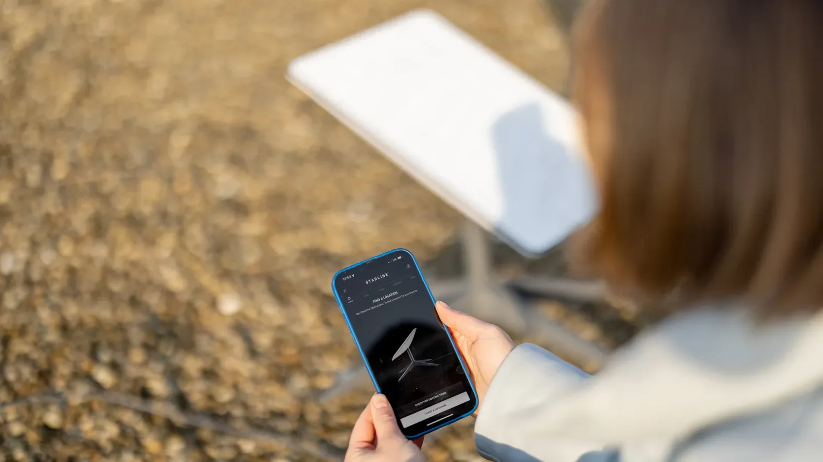 A portable satellite internet dish set up outdoors for travel connectivity