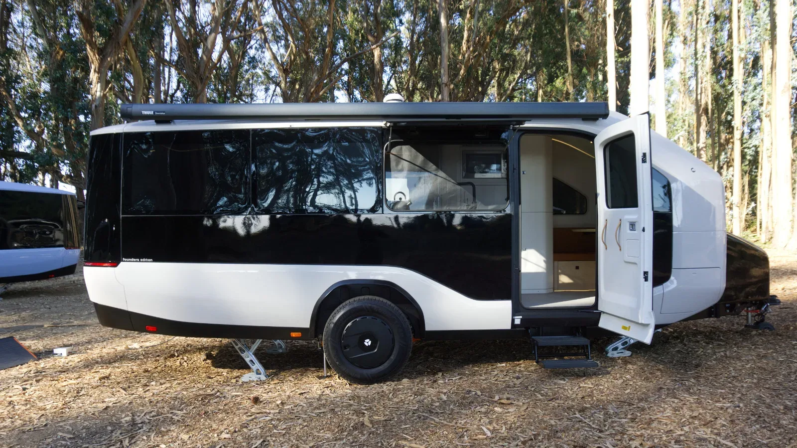 Pebble Flow electric trailer parked at a campsite