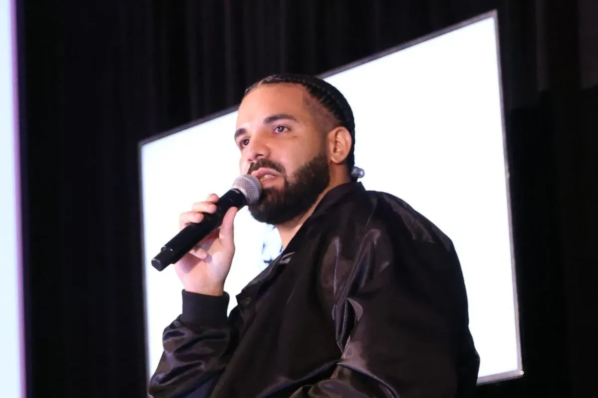 Drake performing onstage during a live music set