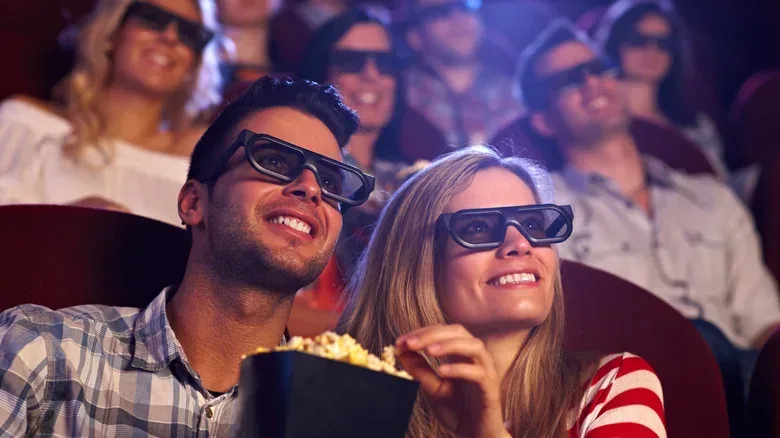 Moviegoer comparing IMAX 2D and IMAX 3D screening options