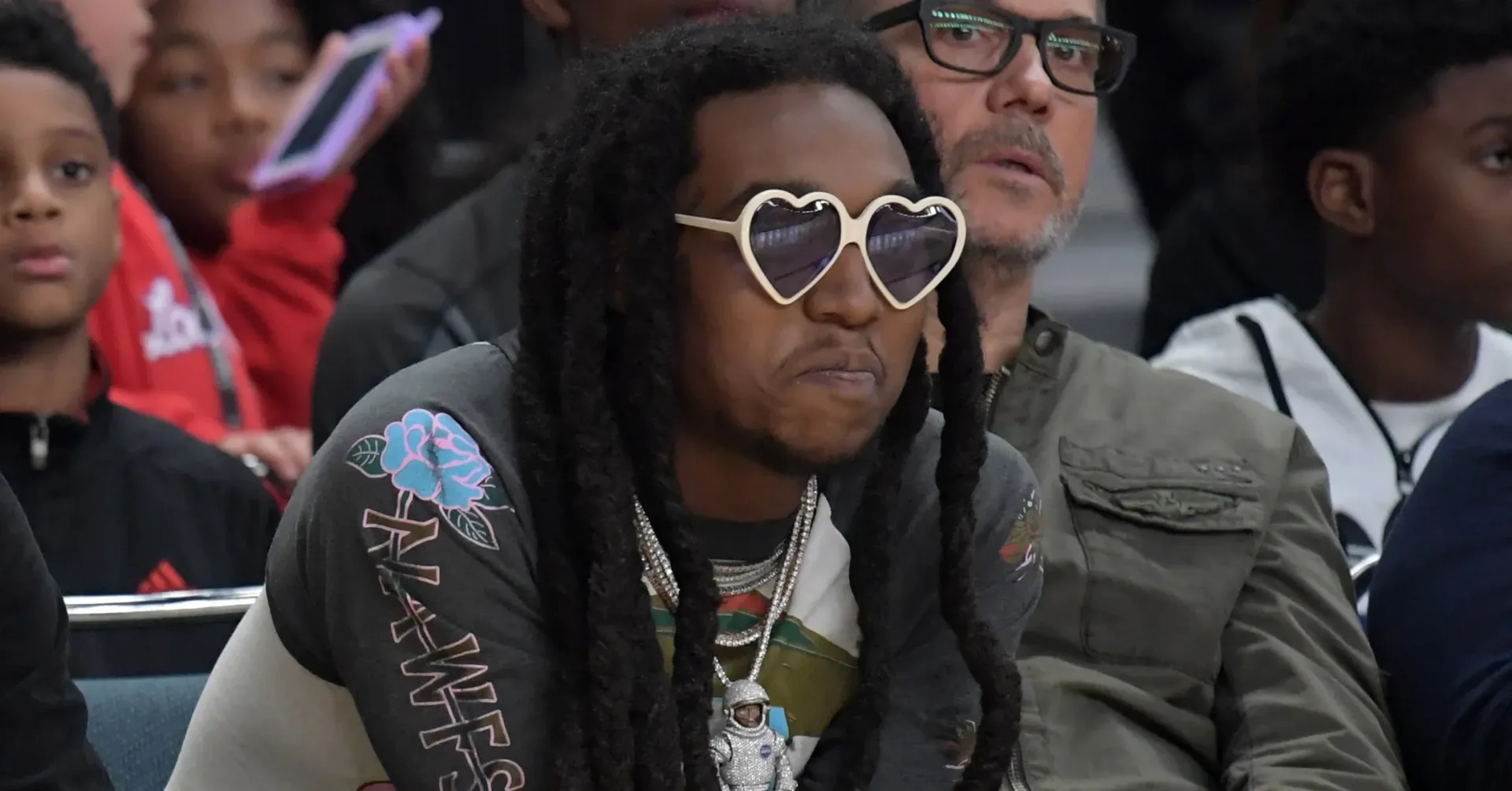 Takeoff performing onstage during a live appearance