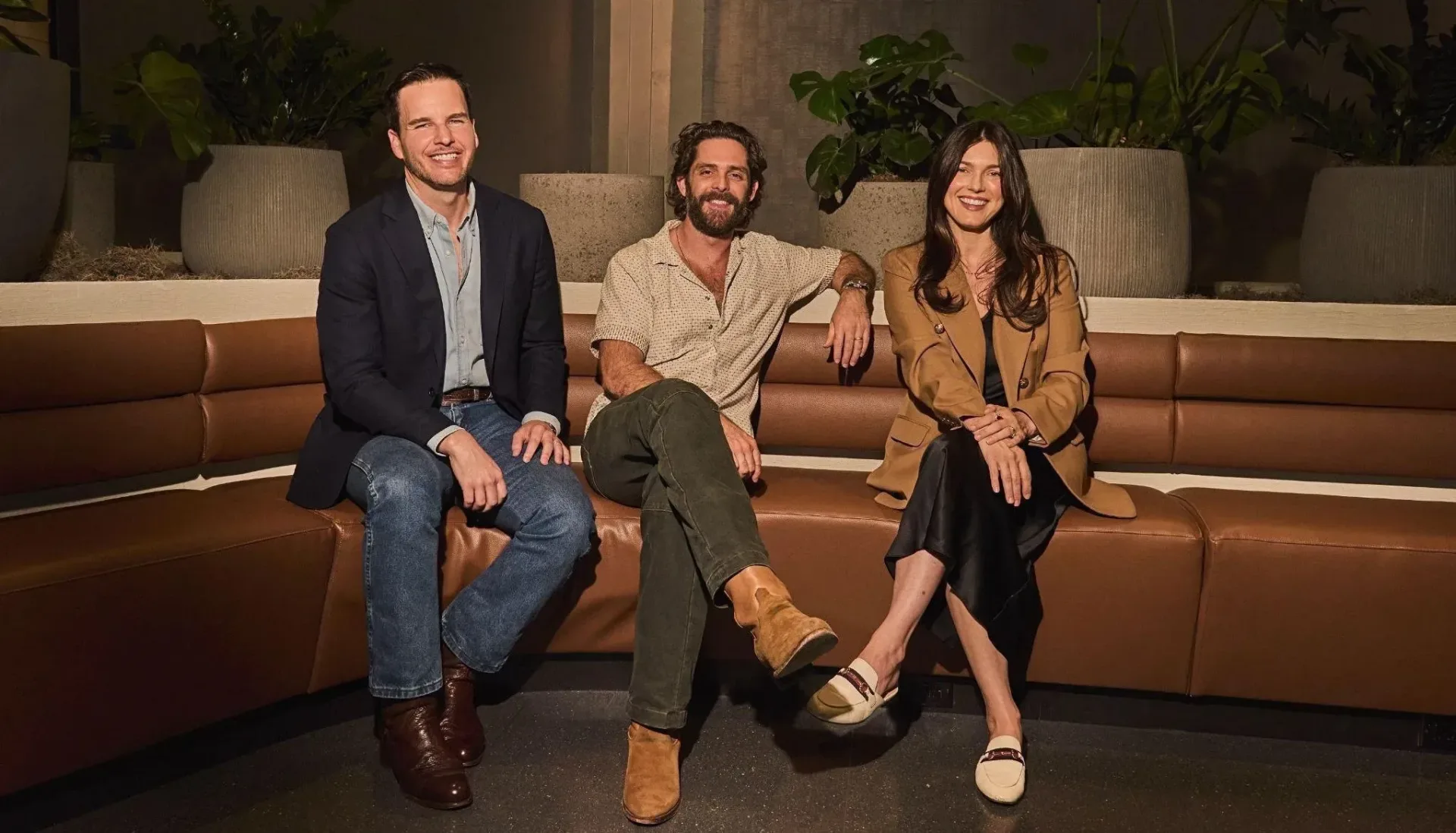 Thomas Rhett stands with Blue Highway CEO Jake Basden and G Major Management’s Virginia Bunetta following the Fifty-One/Forty-Nine Records partnership announcement.