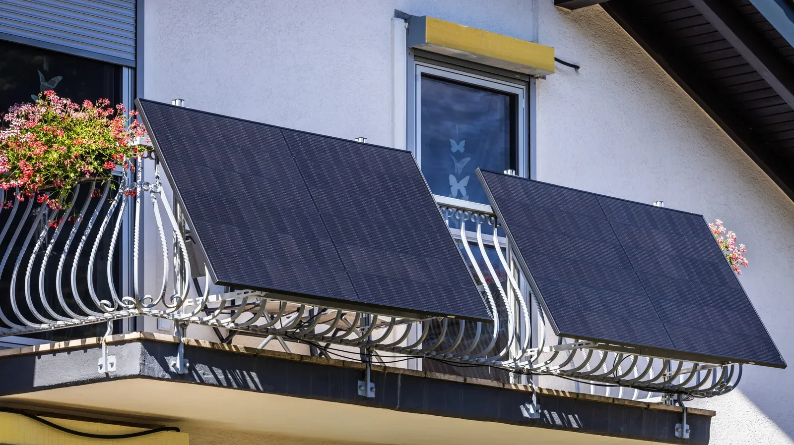 A solar panel installed on an apartment balcony