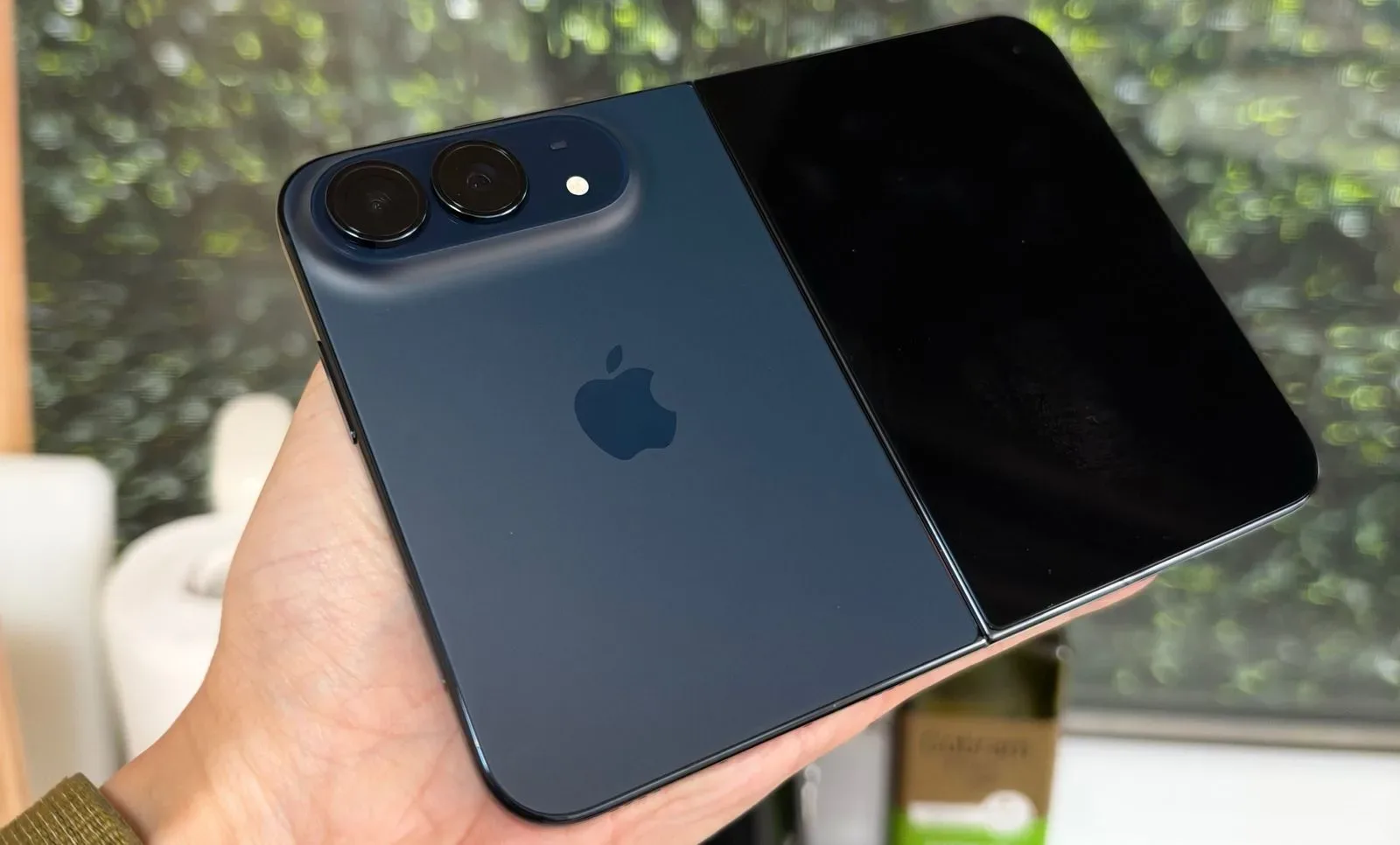 An iPhone Duo folded closed beside its retail box