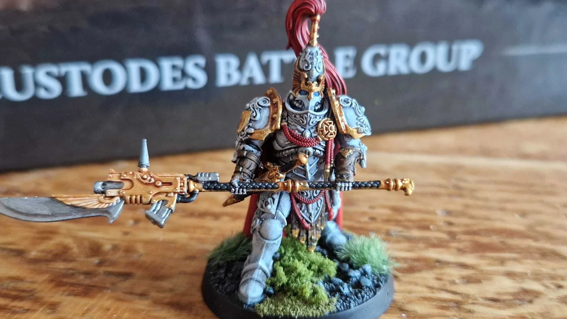 Adeptus Custodes miniatures in gold armour on a Warhammer 40,000 tabletop
