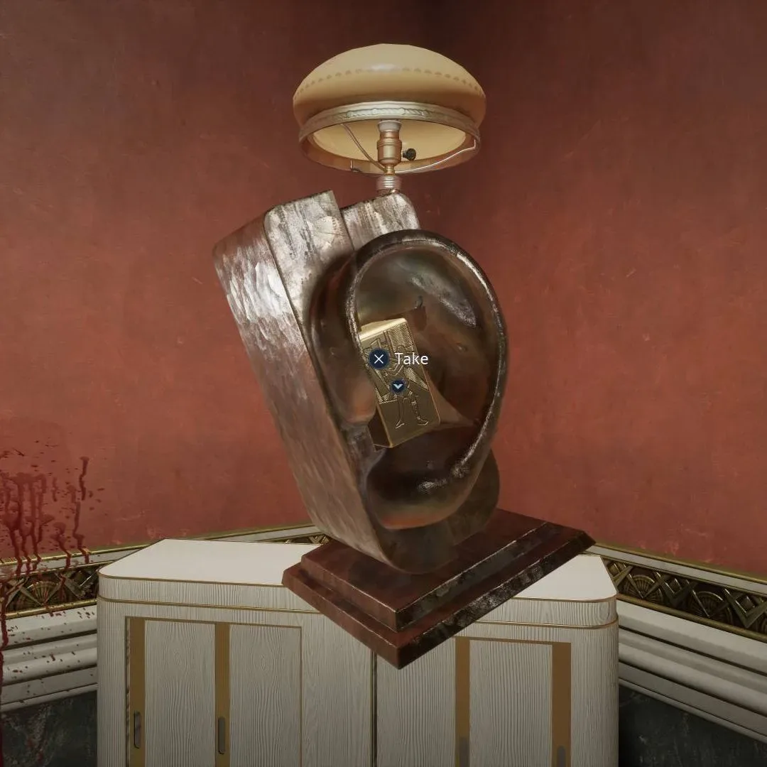 Ear statue on a white dresser containing the Private Rooms embossed block