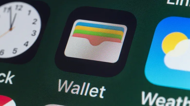 A hardware crypto wallet beside a smartphone representing cold and hot wallet access