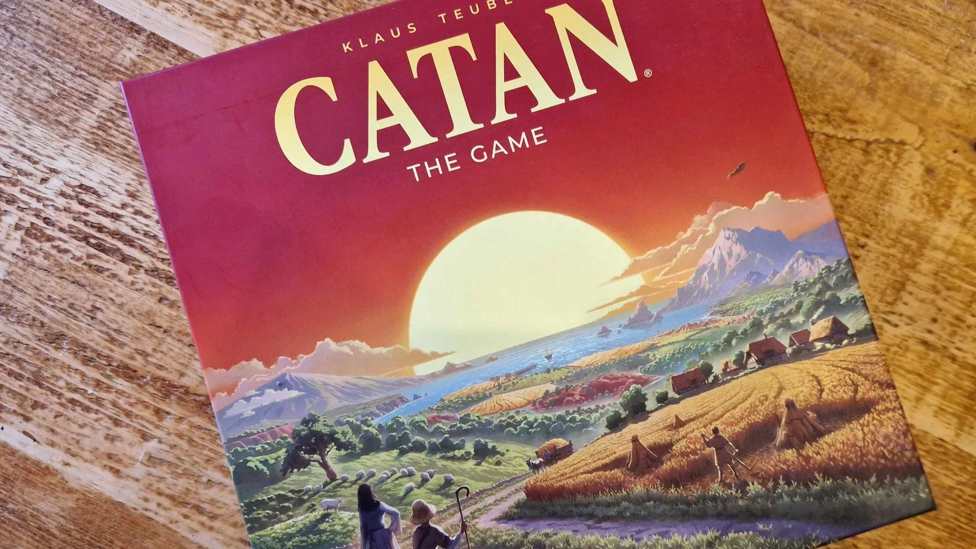 Catan resource tiles and player pieces arranged for a family board game