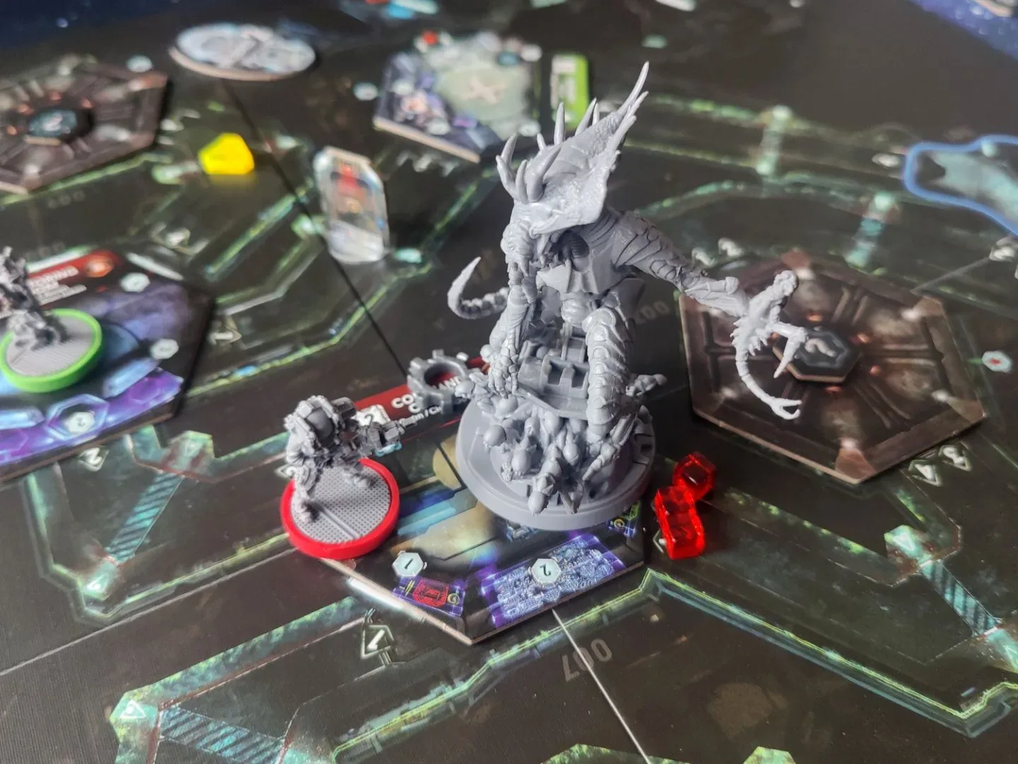 Nemesis board game models and tokens laid out on a board