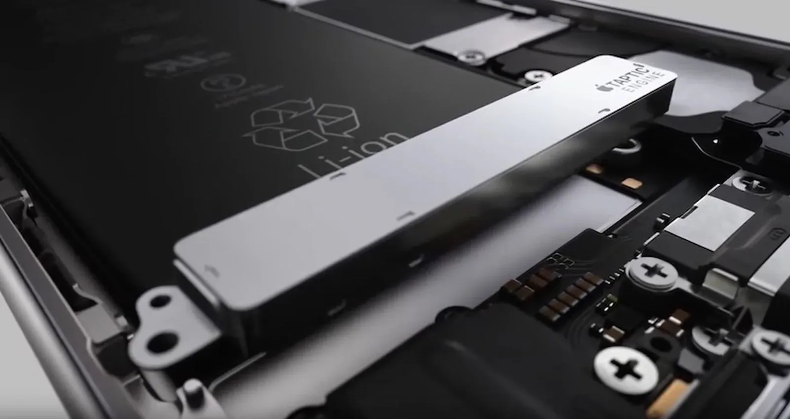 An iPhone and Apple Watch representing the patent dispute over haptic feedback technology
