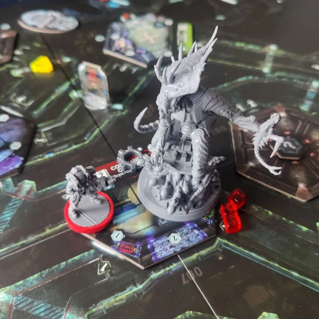 Nemesis board game components depicting a tense alien-survival scenario