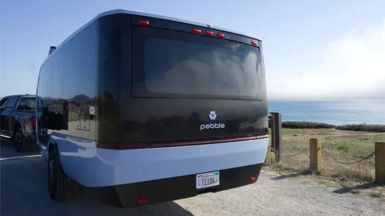 Towing the Pebble Flow trailer with a Ford 150.