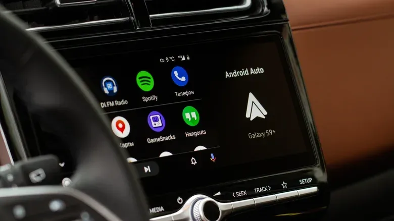 Car dashboard connected to Android Auto with media playback paused