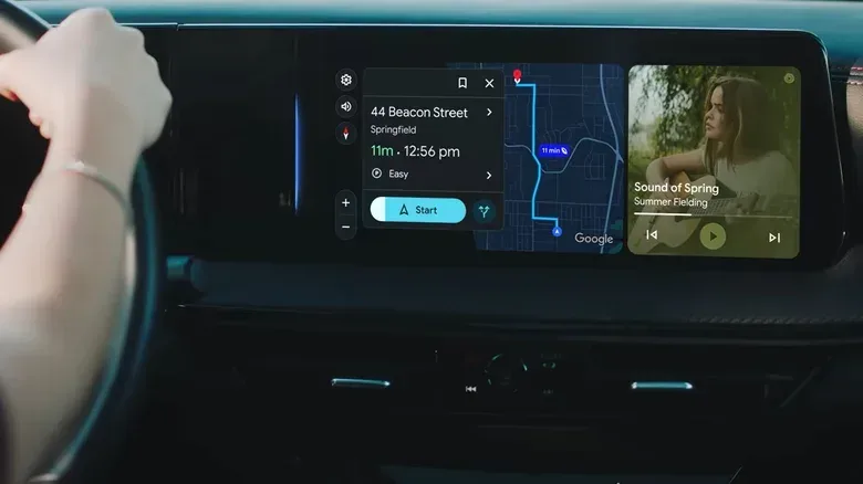 Driver using a car dashboard interface with Google Maps