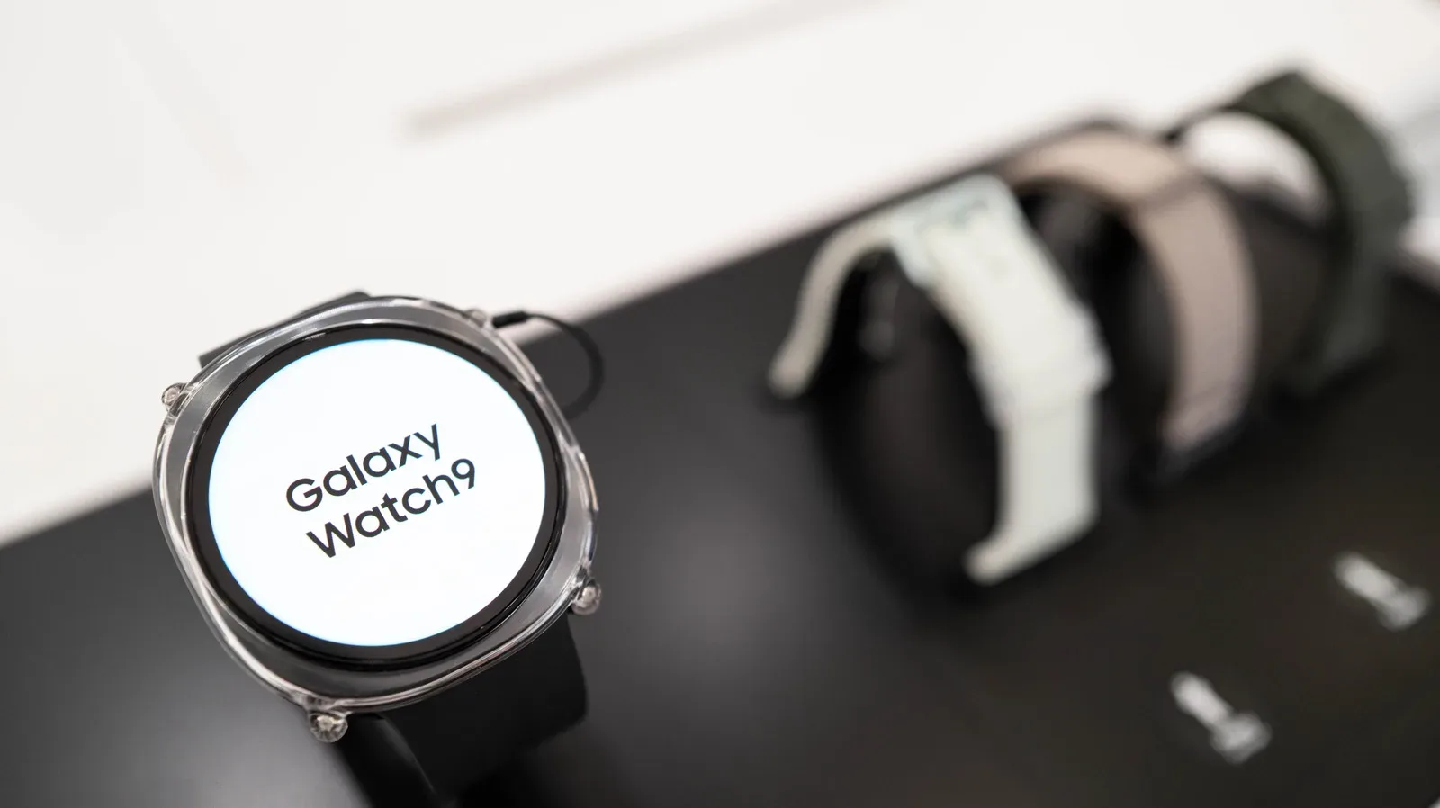 Samsung Galaxy Watch face showing an orange unread-notification dot on the left side