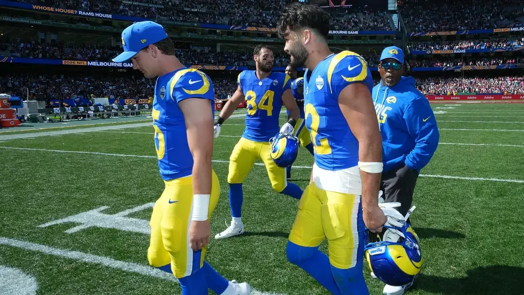 Los Angeles Rams quarterback Ty Simpson leaves the field with teammates after the NFL Melbourne Game.